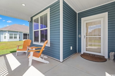 Porch featuring a lawn