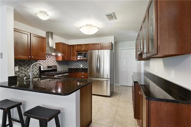 Kitchen - Counter-height bar, granite counters, ti