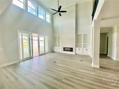 Volume ceiling in great room with fireplace and ex