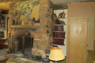 Stone fireplace and wood elevator