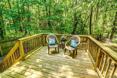 Deck overlooking fully fenced level rear yard