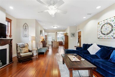 Living space with gleaming wood floors and a Faux 