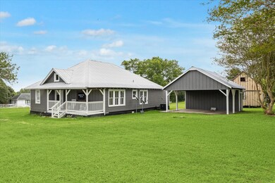 2 car carport with storage space attached.