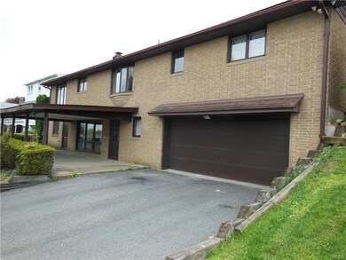 Rear view of house shows on-grade walk-out access 