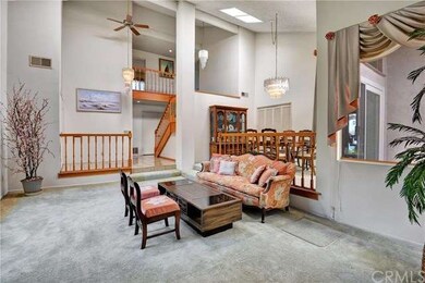 Bright & open living room with a skylight that bri