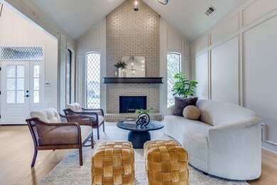 Living room featuring a fireplace, light hardwood 