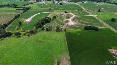 Aerial overview of property's location featuring rural landscape