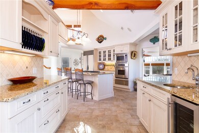 A gourmet kitchen with wet bar area and wine chill