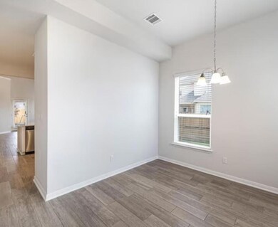 Unfurnished room with wood finished floors and a 