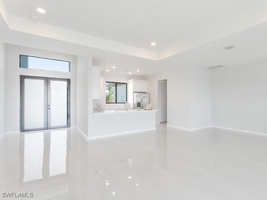 Unfurnished living room featuring french doors and
