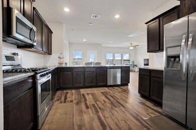 Poplar open space floor plan with bay of windows to allow natural light. Imagine entertaining, family time together.