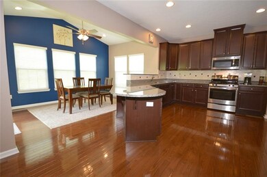OPEN CONCEPT KITCHEN WITH CHERRY CABINET & MORNING