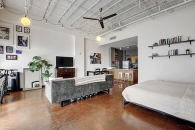 Bedroom featuring a high ceiling and freestanding