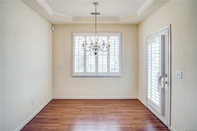 Dining area with trey ceiling and access to porch