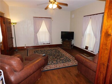 Beautiful woodwork and lovely hardwood floors enha