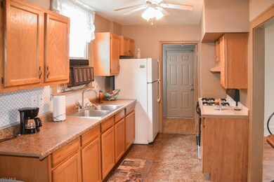 Updated kitchen with oak cabinets and newer counte