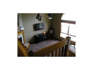 Overlooking living room with large windows.