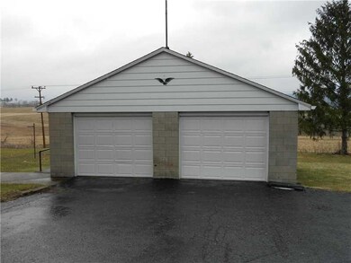 Parking Lot/Garage. Detached 2 car garage with hea