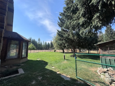 View of yard with a sunroom