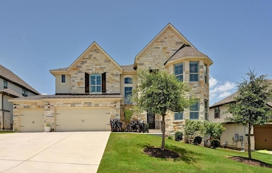 View of front of property featuring stone siding,