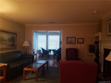Great room opens to naturally lite sunroom