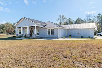 View of front of house featuring covered porch and