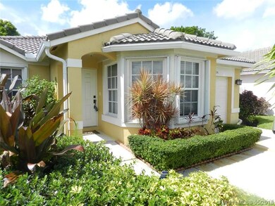 Landscaped front yard and walkway featuring quaint