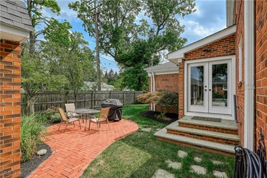 View of yard with french doors and a patio area