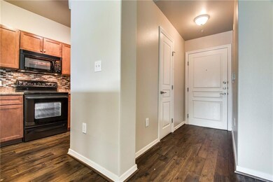 Enter the condo from an interior hallway and be gr