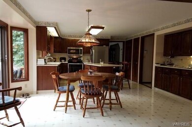 EAT IN KITCHEN WITH BAY WINDOW/DOORS OPEN TO FAMIL
