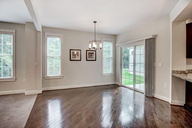 Cheerful dining area with walkout to covered porch