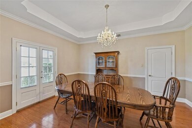 Large formal dining room with recessed ceilings an