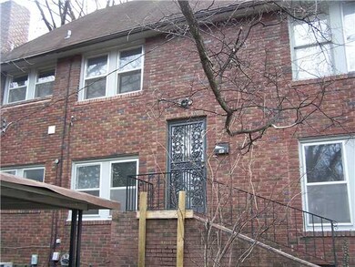 SIDE OF HOUSE.  STAIRS GO UP TO UPSTAIRS UNIT