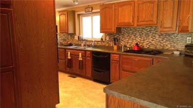 Large and modern kitchen boasts TONS of cabinets a