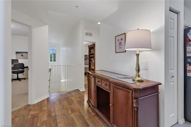 Corridor featuring dark hardwood / wood-style floo