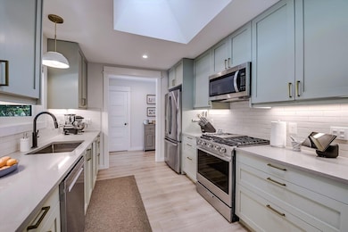 Kitchen featuring stainless steel appliances, dec