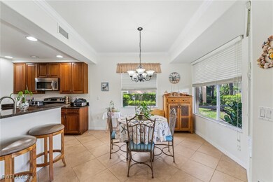 Dining area with an inviting chandelier, ornamenta