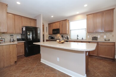 There's no shortage of cabinets in this room, and plenty of space to works.