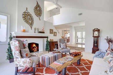 Living room featuring 1 of 3 large fireplaces