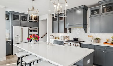 Kitchen with upper glass cabinetry