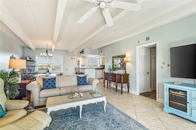 Living room featuring beam ceiling.