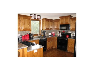 Granite countertops with tile backsplash in kitche