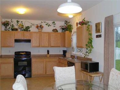 Kitchen. Sliding glass doors offer access to the b