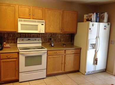 Kitchen with stamped metal backsplash