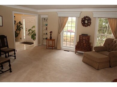 Living Room. Spacious living room with crown & den