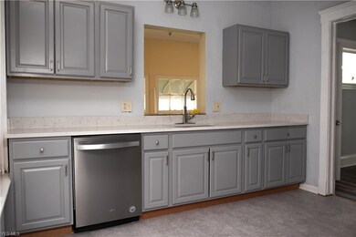 Freshly painted cabinets and all new kitchen appliances.