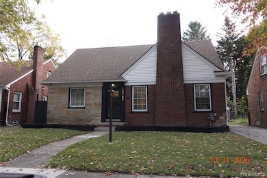 Bungalow-style home featuring a front yard, a shingled roof, a chimney, and stone siding