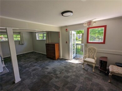 Unfurnished room with dark carpet