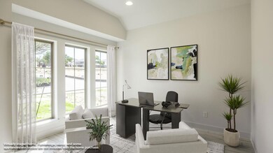 Office area with vaulted ceiling, baseboards, woo