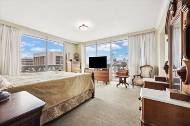 Bedroom featuring light carpet